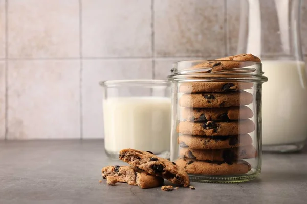Glass Jar Delicious Chocolate Chip Cookies Milk Grey Table Space — Stock Photo, Image