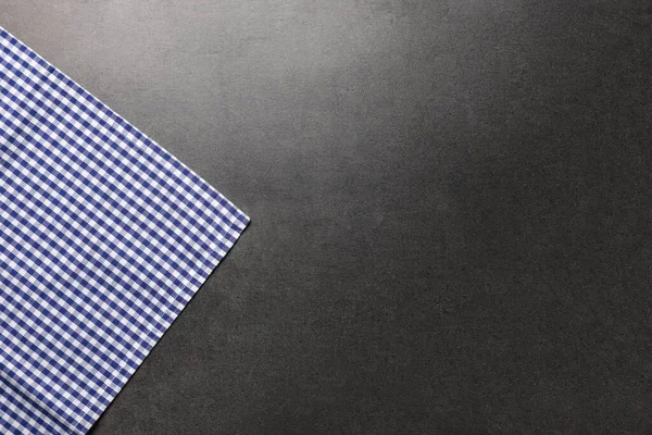 stock image Checkered tablecloth on grey background, top view. Space for text