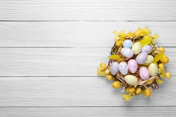 Festively Decorated Easter Eggs White Wooden Table Top View Space —  Fotos de Stock
