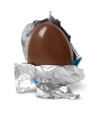 Tasty chocolate egg in foil isolated on white