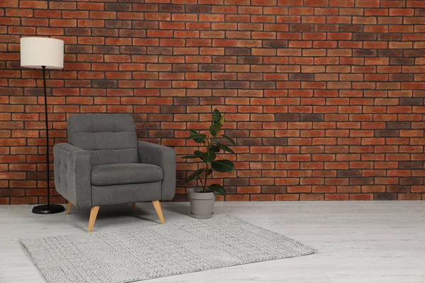 Cosy Armchair Lamp Potted Plant Brick Wall Room Space Text —  Fotos de Stock