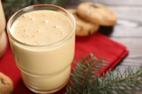Tasty Eggnog Cookies Fir Branches Wooden Table Closeup — Stockfoto