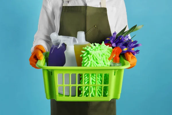Spring Cleaning Woman Holding Basket Detergents Flowers Tools Light Blue — Zdjęcie stockowe
