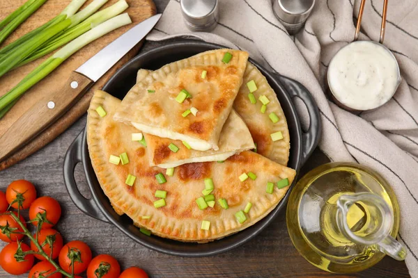 Delicious Fried Chebureki Cheese Green Onion Ingredients Wooden Table Flat — Stock Photo, Image