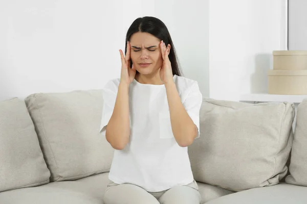 Young Woman Suffering Headache Sofa Home Hormonal Disorders — Stock Fotó