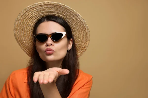 Beautiful Young Woman Straw Hat Blowing Kiss Beige Background Space — Stockfoto