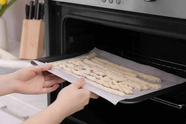 Woman Putting Baking Sheet Homemade Breadsticks Oven Kitchen Closeup Cooking —  Fotos de Stock
