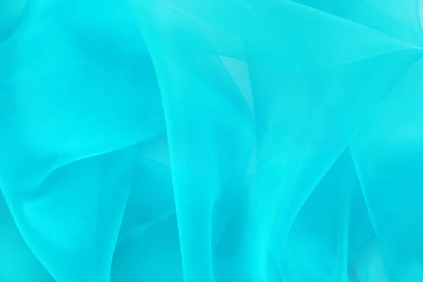 背景として美しいターコイズブルーのチュール生地 クローズアップ — ストック写真