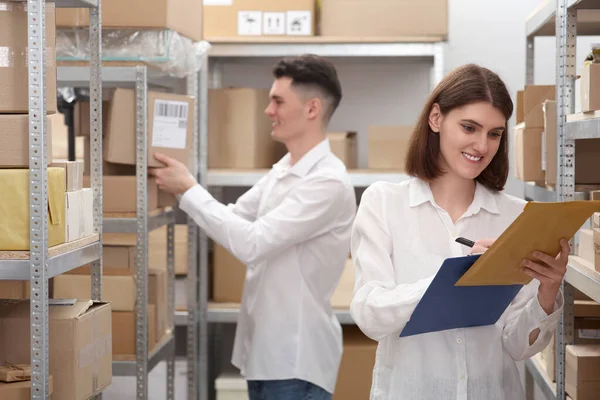 Young Post Office Employees Working Warehouse — Stockfoto