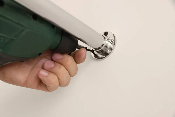 stock image Worker installing new metal pipes with electric drill, closeup