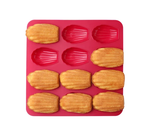 stock image Tasty madeleine cookies in baking mold isolated on white, top view