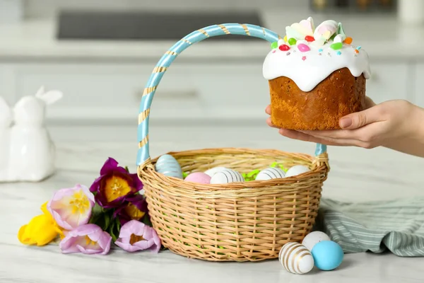 Woman Holding Tasty Easter Cake Wicker Basket Painted Eggs Flowers — Stock Photo, Image
