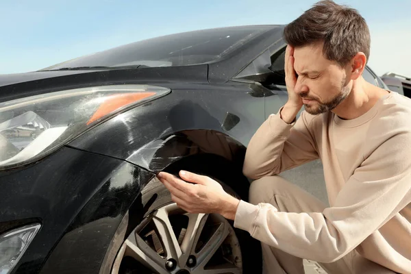 stock image Stressed man near car with scratch outdoors