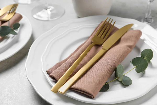 Stylish Setting Cutlery Eucalyptus Leaves Light Grey Table Closeup — Stock Photo, Image