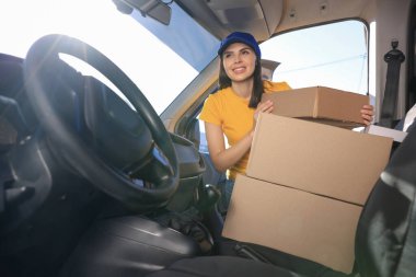 Courier taking parcel from car. Delivery service