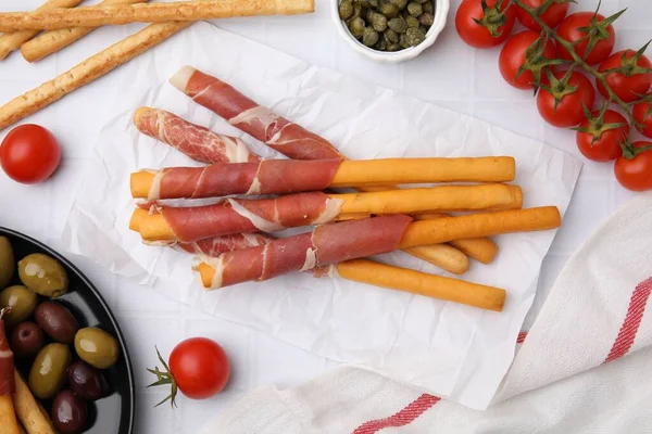 Delicious Grissini Sticks Prosciutto Snacks White Table Flat Lay — Foto de Stock