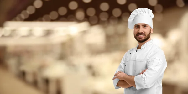 Smiling chef in uniform at restaurant, space for text. Banner design