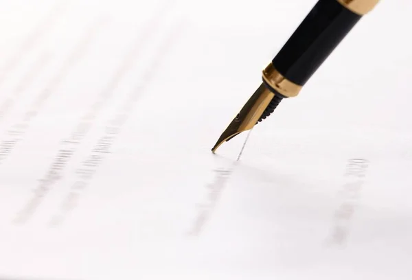 Writing on document with fountain pen, closeup. Notary contract