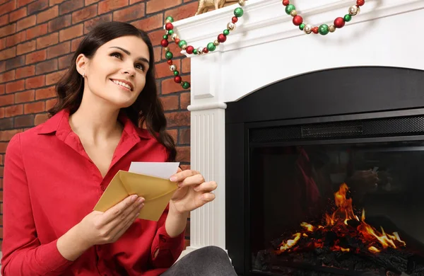 Young Woman Greeting Card Sitting Fireplace Indoors — Fotografia de Stock