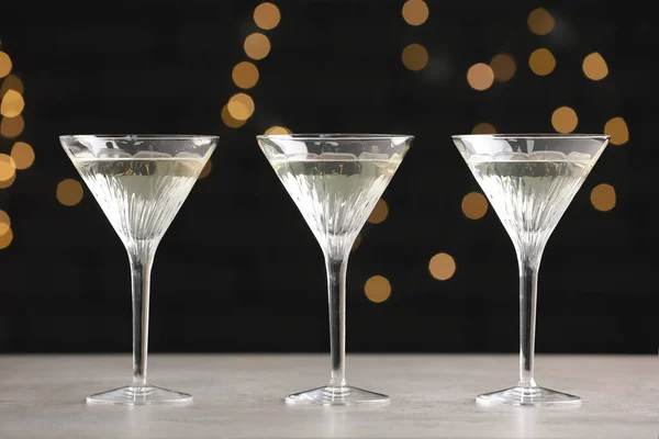 stock image Martini glasses of refreshing cocktails on light grey table