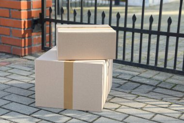 Stack of parcels delivered near front gates