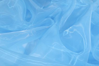 Arka plan olarak güzel açık mavi tül kumaş, yakın plan