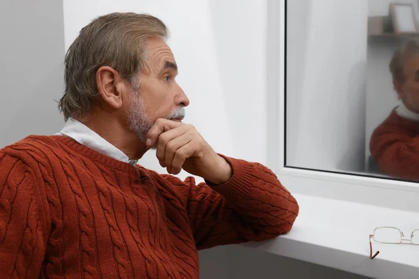 Upset Senior Man Looking Window Indoors Loneliness Concept — Stock Photo, Image