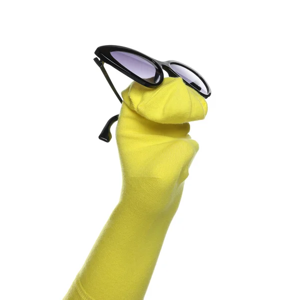 Funny sock puppet with sunglasses isolated on white