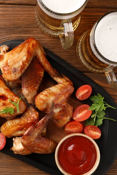 Mugs Beer Delicious Baked Chicken Wings Sauce Wooden Table Flat — Stock Photo, Image
