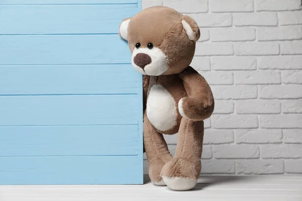 Cute Teddy Bear Light Blue Wooden Wall Brick Background Space — Stock Photo, Image
