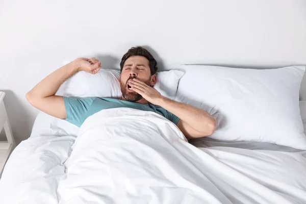 Handsome Man Yawning While Lying Pillow Bed Home — Fotografia de Stock