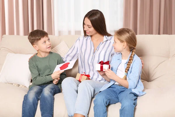 Cute Little Children Presenting Mother Gifts Sofa Home — Stock Photo, Image