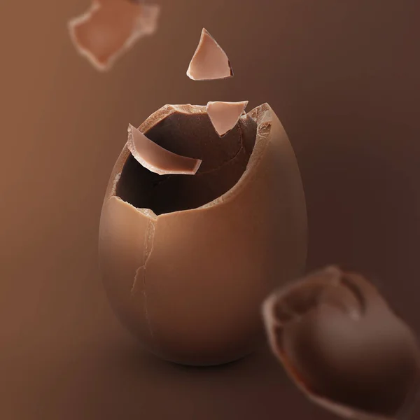 Exploded Milk Chocolate Egg Bruine Achtergrond — Stockfoto