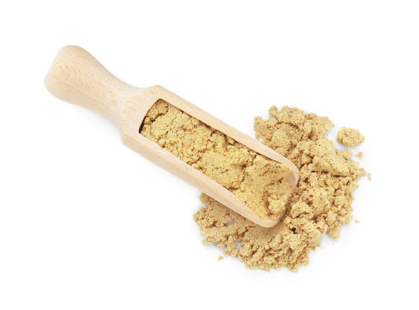 stock image Wooden scoop with aromatic mustard powder on white background, top view