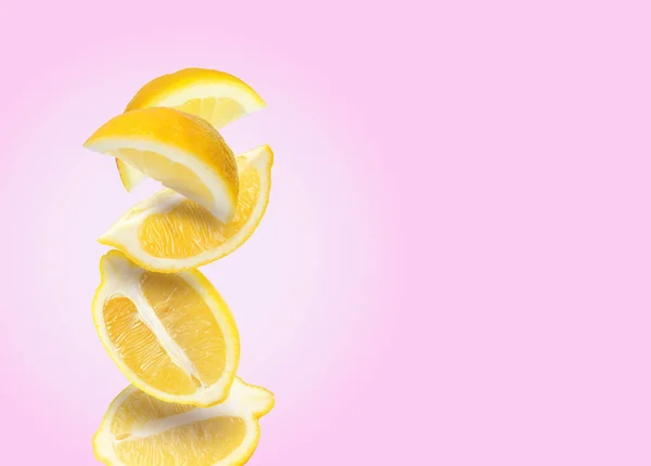 Cut Fresh Ripe Lemons Falling Pink Background Space Text — Stock Photo, Image
