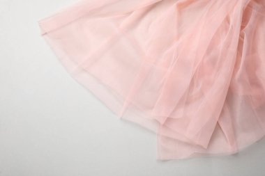 Beautiful tulle fabric on light grey background, top view