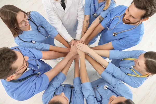 Doctor Interns Stacking Hands Together Indoors Top View — Stock Photo, Image