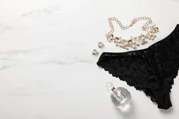 Elegant Black Women Underwear Accessories Perfume White Marble Background Flat — Stock Photo, Image