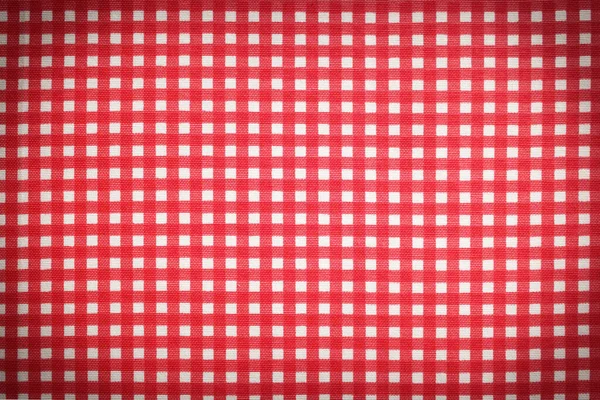 Red and white tablecloth as background, vignette effect