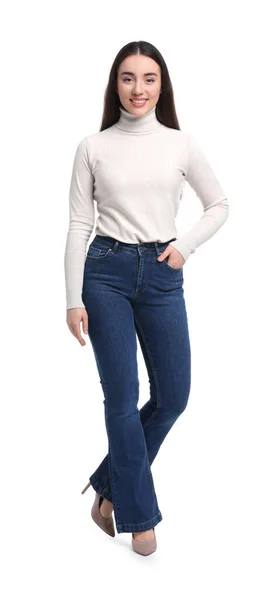 白色背景时尚牛仔裤的年轻女子 — 图库照片
