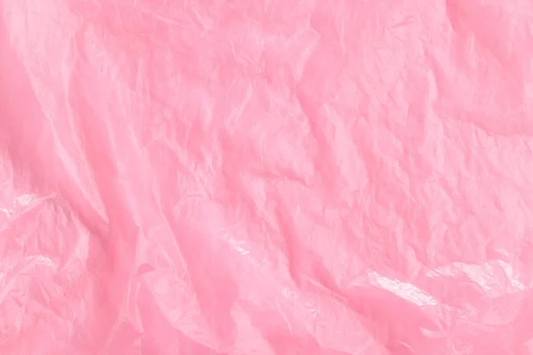 背景として砕いたピンクのビニール袋 トップビュー — ストック写真
