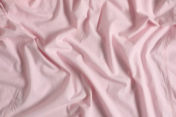 Gekromde Roze Stof Als Achtergrond Bovenaanzicht — Stockfoto