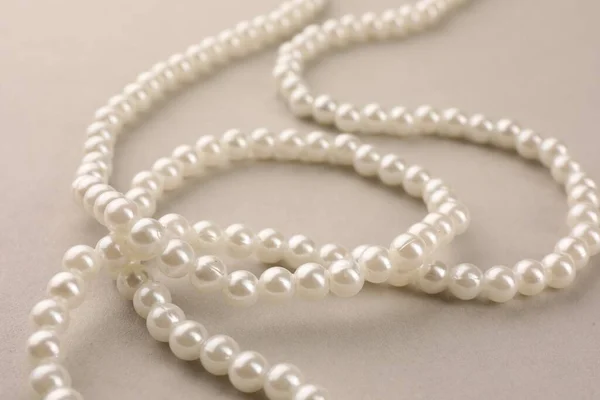 Elegant Pearl Necklace Beige Background Closeup — Stock Photo, Image