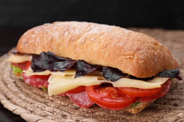 Delicious Sandwich Cheese Salami Tomato Wicker Mat Closeup — Stock Photo, Image