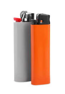Stylish small pocket lighters on white background
