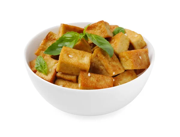 stock image Plate with delicious fried tofu, basil and sesame seeds isolated on white