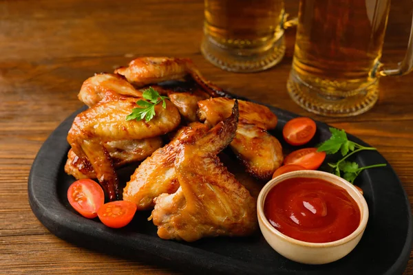 Mugs Beer Delicious Baked Chicken Wings Sauce Wooden Table — Stock Photo, Image