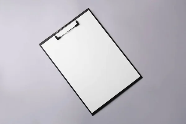 Black Clipboard Sheet Blank Paper Light Grey Background Top View — Stock Photo, Image
