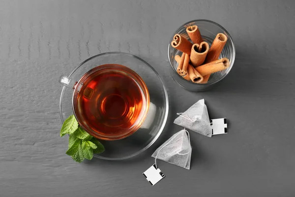 Tea Bags Cup Hot Drink Mint Cinnamon Sticks Grey Wooden — Stock Photo, Image