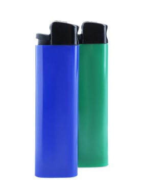 Stylish small pocket lighters on white background